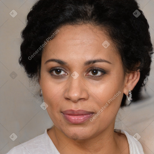 Joyful black adult female with short  brown hair and brown eyes