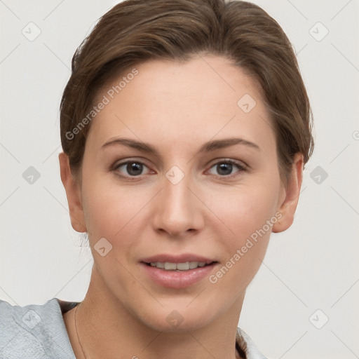 Joyful white young-adult female with short  brown hair and grey eyes