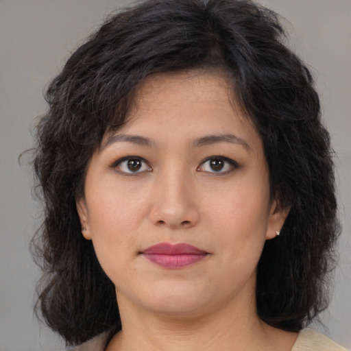 Joyful asian young-adult female with medium  brown hair and brown eyes