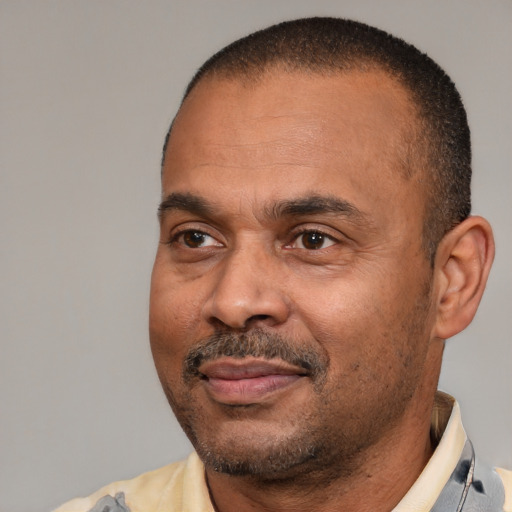 Neutral latino adult male with short  brown hair and brown eyes