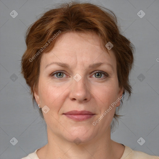 Joyful white adult female with medium  brown hair and grey eyes