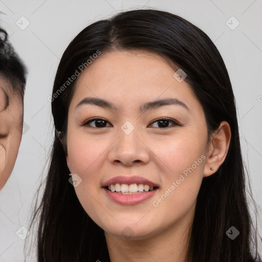 Joyful white young-adult female with long  black hair and brown eyes