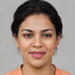 Joyful asian young-adult female with medium  brown hair and brown eyes