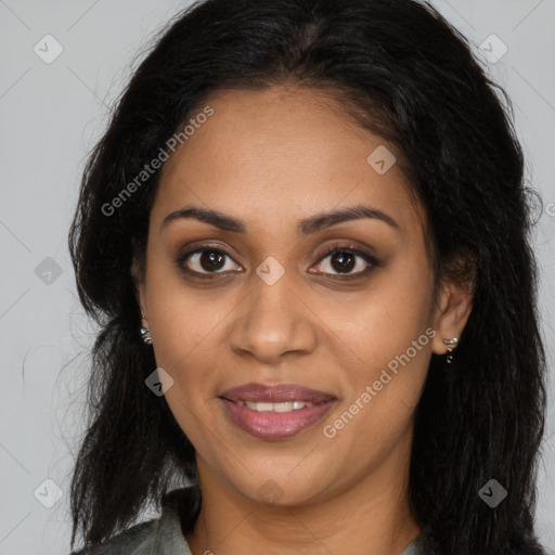 Joyful black young-adult female with long  brown hair and brown eyes