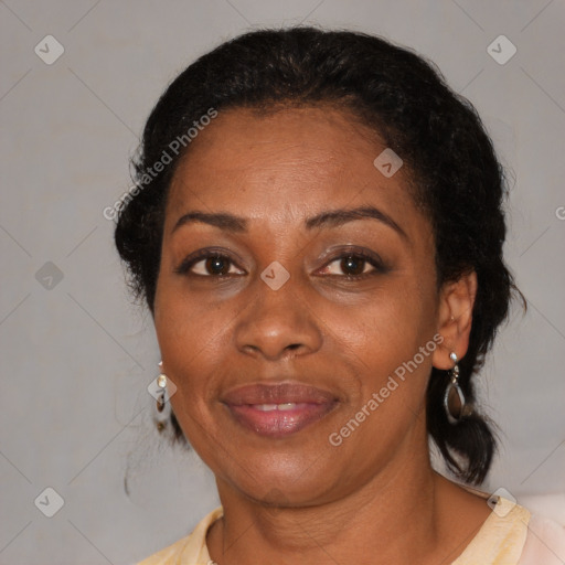 Joyful black adult female with medium  brown hair and brown eyes