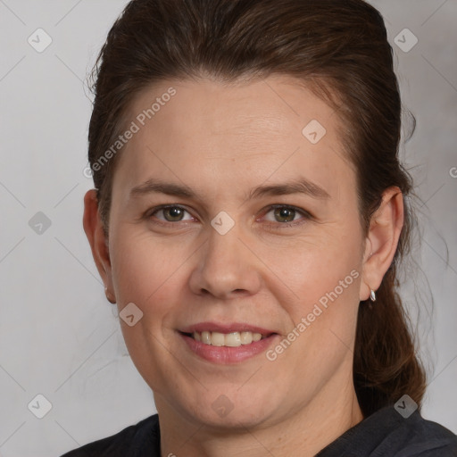 Joyful white adult female with short  brown hair and brown eyes