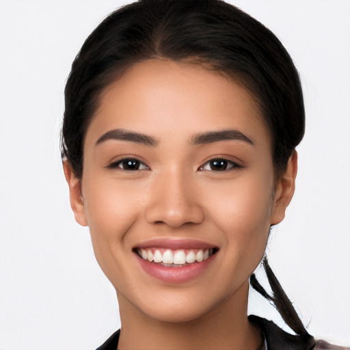 Joyful latino young-adult female with short  brown hair and brown eyes