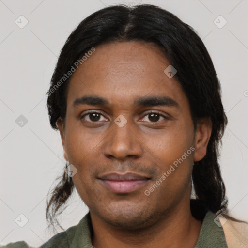 Joyful black young-adult male with short  black hair and brown eyes