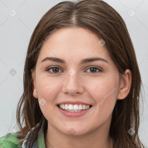 Joyful white young-adult female with long  brown hair and grey eyes