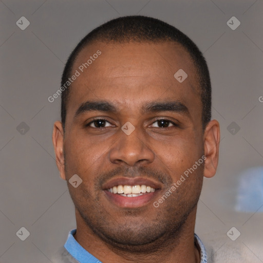 Joyful black young-adult male with short  brown hair and brown eyes