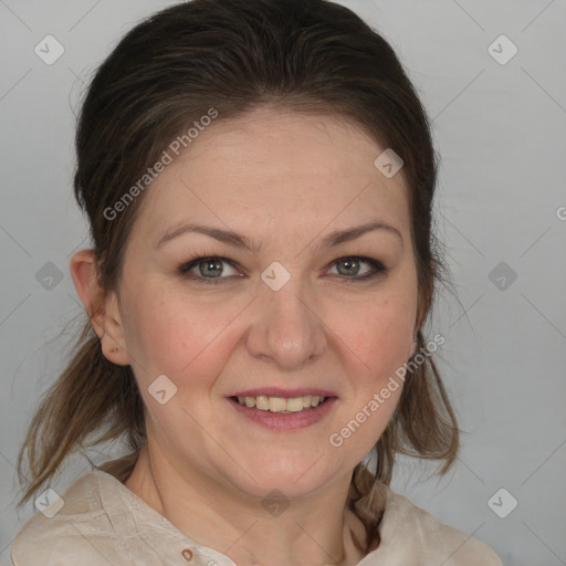 Joyful white adult female with medium  brown hair and blue eyes