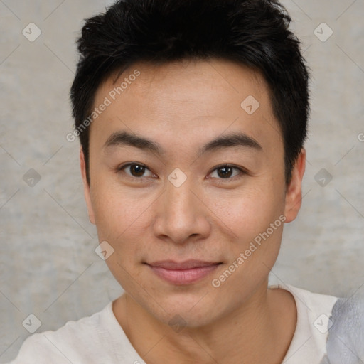 Joyful asian young-adult male with short  black hair and brown eyes