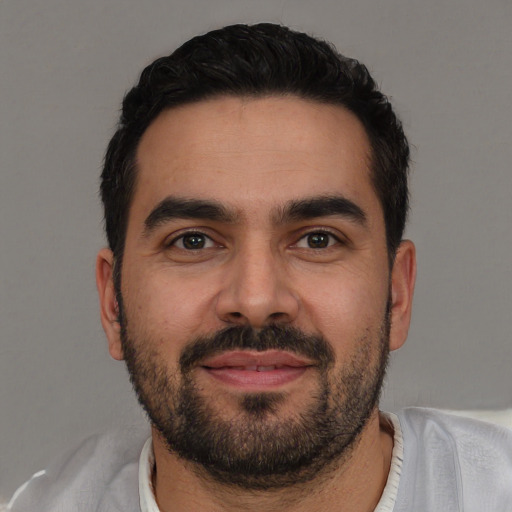 Neutral white young-adult male with short  black hair and brown eyes