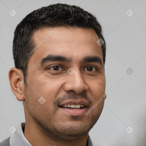 Joyful white young-adult male with short  black hair and brown eyes