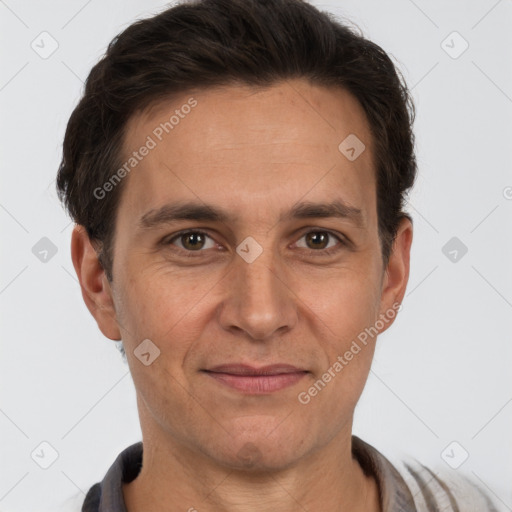 Joyful white adult male with short  brown hair and brown eyes