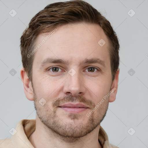 Joyful white adult male with short  brown hair and grey eyes