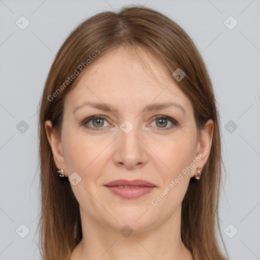 Joyful white adult female with long  brown hair and grey eyes