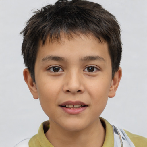 Joyful white child male with short  brown hair and brown eyes