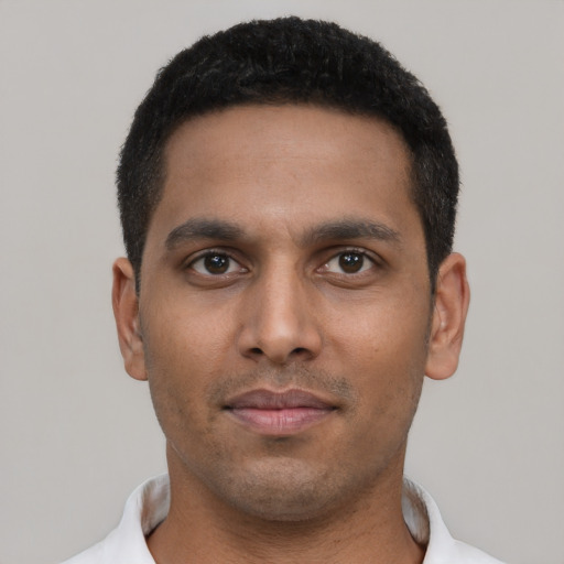 Neutral black young-adult male with short  black hair and brown eyes