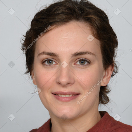 Joyful white young-adult female with medium  brown hair and green eyes