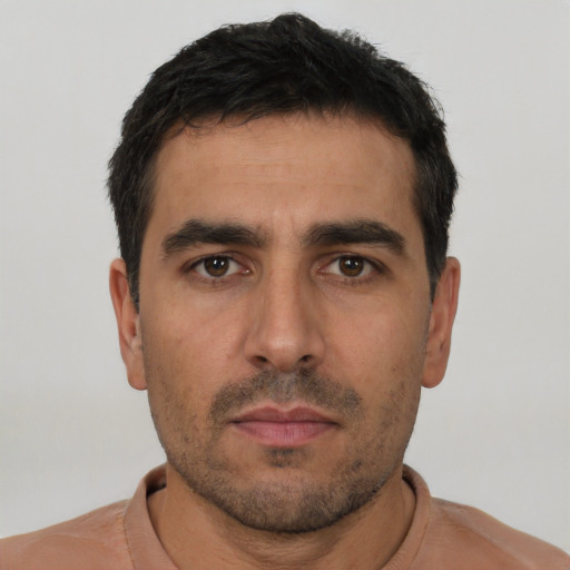 Neutral white young-adult male with short  black hair and brown eyes