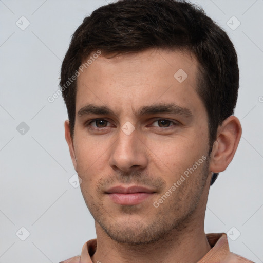 Neutral white young-adult male with short  brown hair and brown eyes