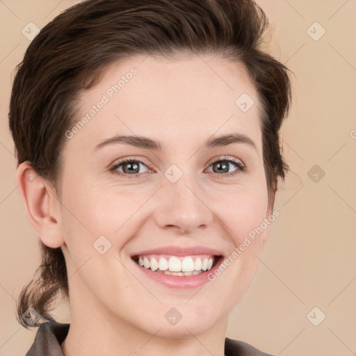 Joyful white young-adult female with short  brown hair and grey eyes