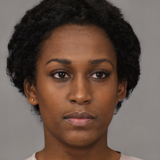 Neutral black young-adult female with short  brown hair and brown eyes