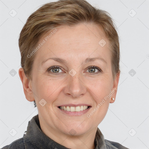 Joyful white adult female with short  brown hair and grey eyes