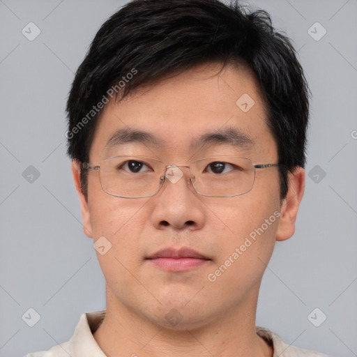 Neutral asian adult male with short  brown hair and brown eyes