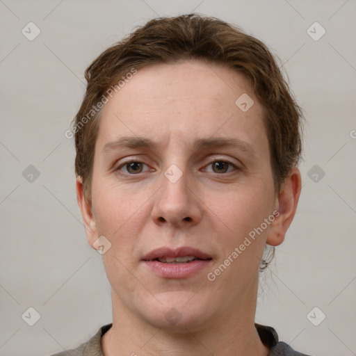 Joyful white young-adult female with short  brown hair and grey eyes