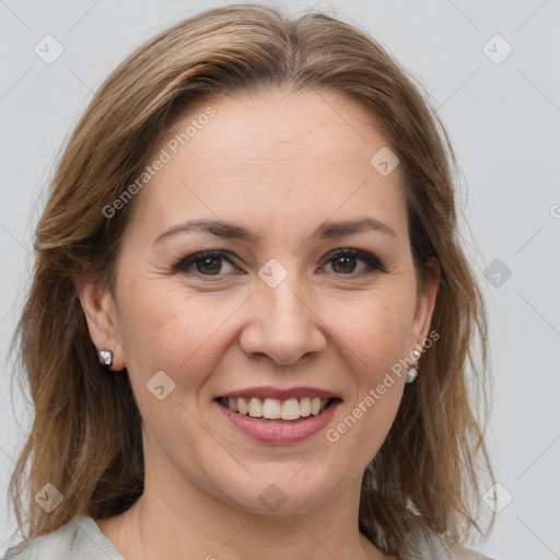 Joyful white adult female with medium  brown hair and grey eyes