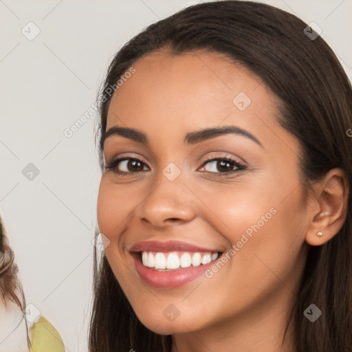 Joyful white young-adult female with long  brown hair and brown eyes