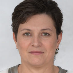 Joyful white adult female with short  brown hair and brown eyes