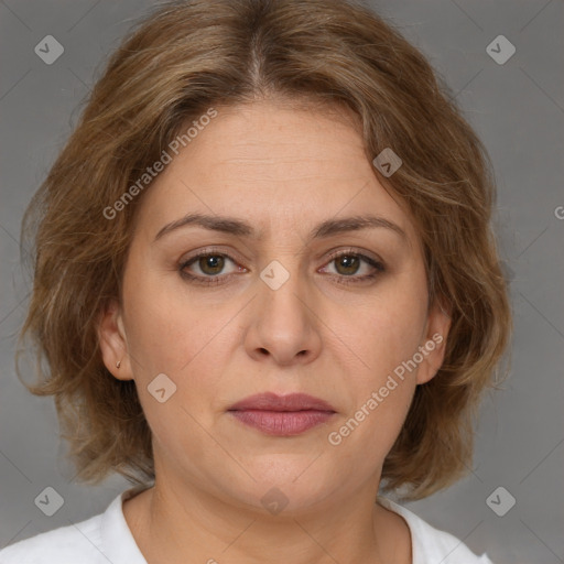 Joyful white adult female with medium  brown hair and brown eyes