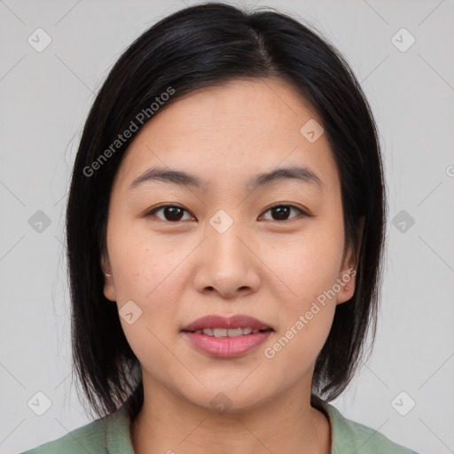 Joyful asian young-adult female with medium  brown hair and brown eyes