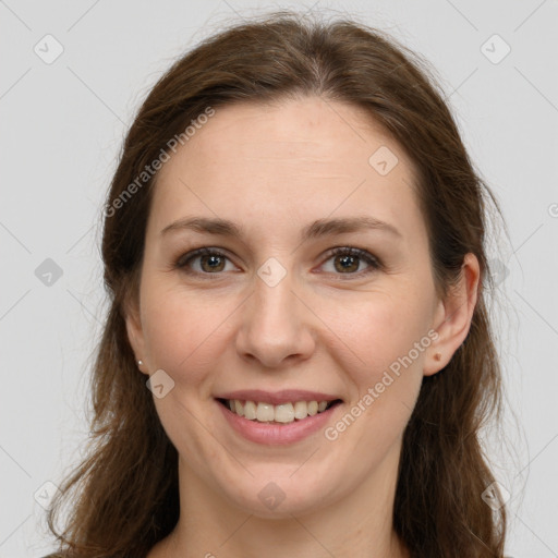 Joyful white young-adult female with long  brown hair and grey eyes