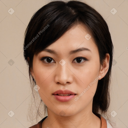 Joyful asian young-adult female with medium  black hair and brown eyes