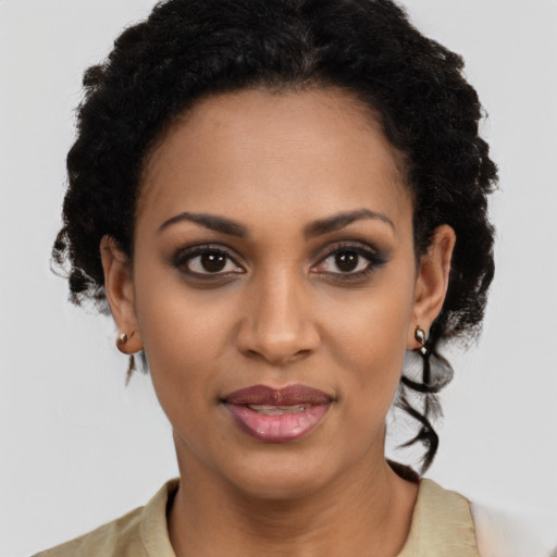 Joyful latino young-adult female with short  black hair and brown eyes