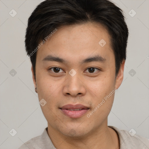 Joyful asian young-adult male with short  brown hair and brown eyes