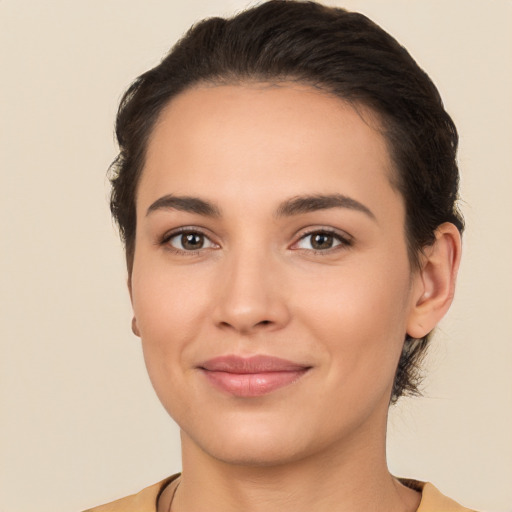 Joyful white young-adult female with short  brown hair and brown eyes