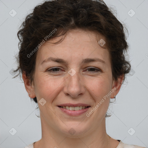 Joyful white adult female with short  brown hair and brown eyes