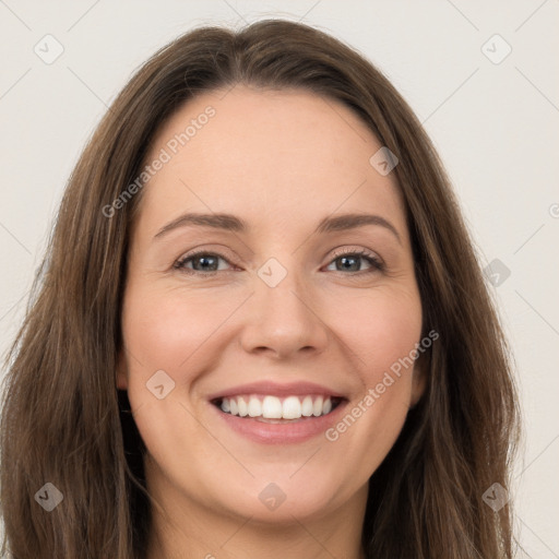 Joyful white young-adult female with long  brown hair and green eyes