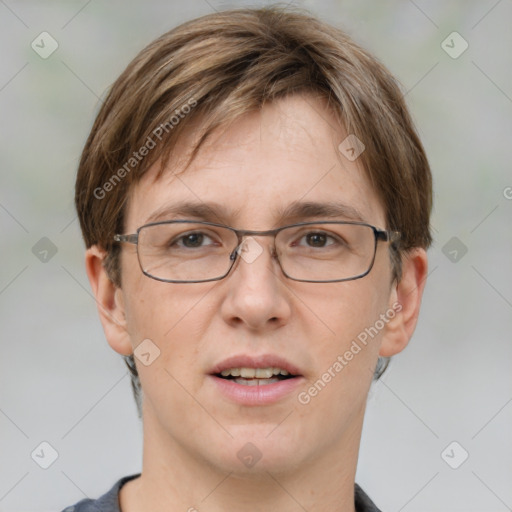 Joyful white adult male with short  brown hair and grey eyes