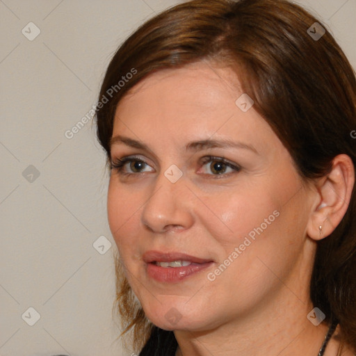 Joyful white adult female with medium  brown hair and brown eyes