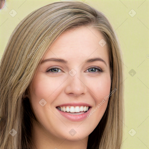 Joyful white young-adult female with long  brown hair and green eyes