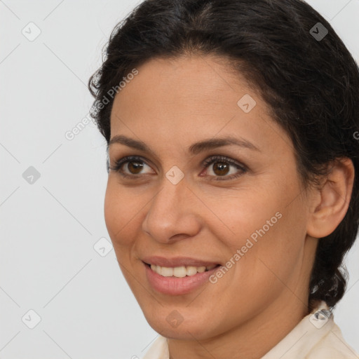 Joyful white adult female with medium  brown hair and brown eyes