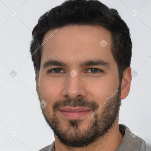 Joyful white young-adult male with short  black hair and brown eyes