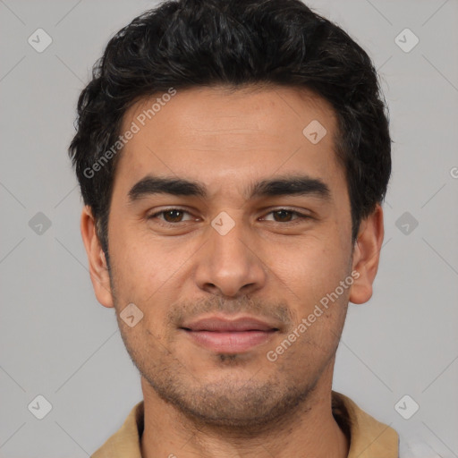 Joyful white young-adult male with short  black hair and brown eyes