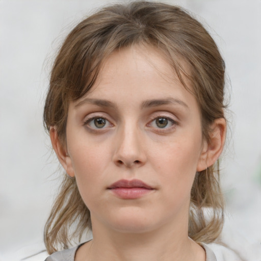 Neutral white young-adult female with medium  brown hair and grey eyes